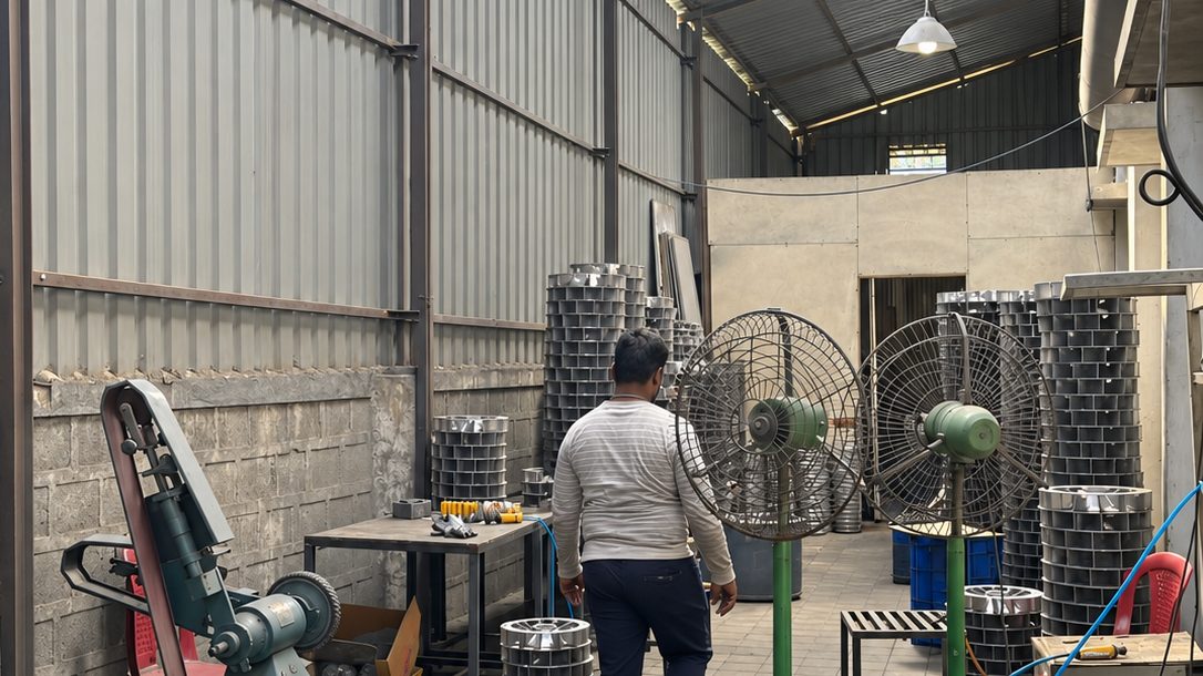 Fettling and finishing bay at Alcast Technologies with stacked aluminium castings